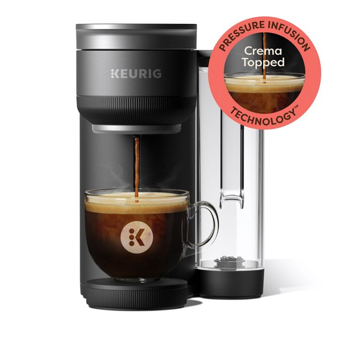 Black Keurig K-Crema single-serve brewer with side water reservoir and cup beneath the outlet